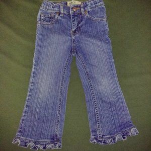 Girl's blue jeans with ruffle leg hem